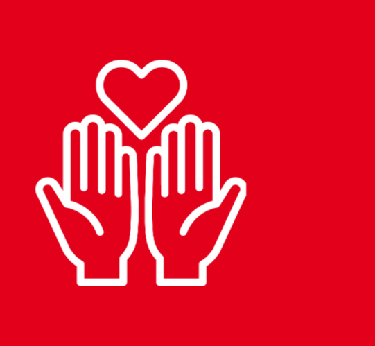 Zwei Hände mit Herz vor rotem Hintergrund.